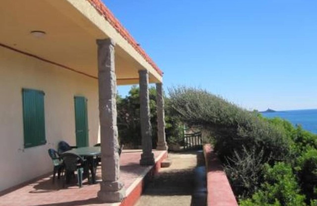 Panoramic sea front housewith garden and beach directly below
