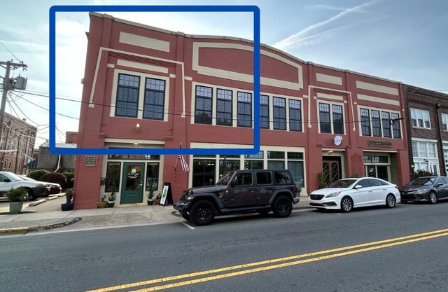 Private condo, river views, off-street parking, and steps from Pailin's Alley