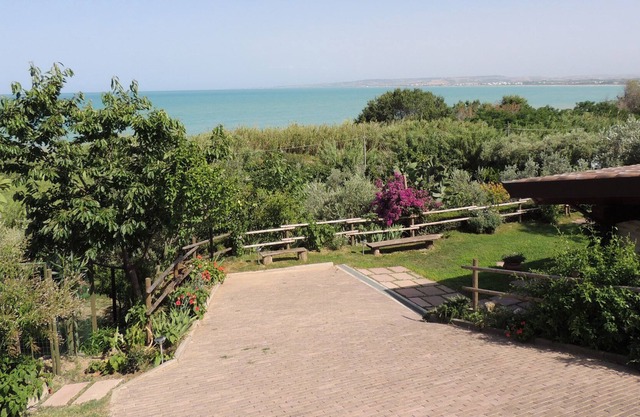 Private house with porch and garden, just steps from the beach