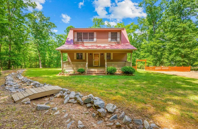 Private lakefront hideaway with dock, swing bench, remote work desk, & AC