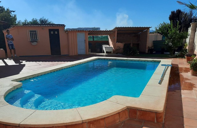 Private villa with heated pool close to the beach.