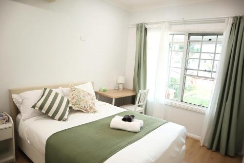 Queen room with shared bathroom