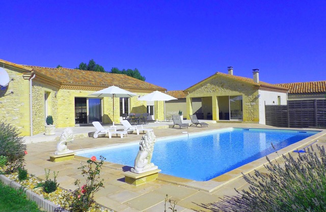 Recent contemporary house in the countryside with swimming pool .
