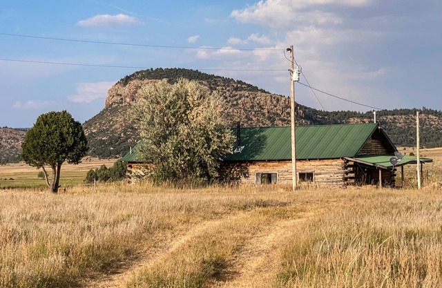 Rustic 4 bedroom cabin with pond on scenic ranch