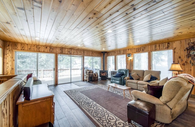 Rustic home with a wood stove, private dry sauna, & two decks with forest views