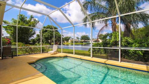 Sabal Harbour pool home with lake views - Harbour Happiness
