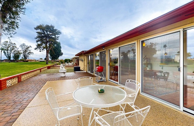 Snowbird-friendly golf-front home with pool, hot tub, grill, smart TVs, W/D, AC