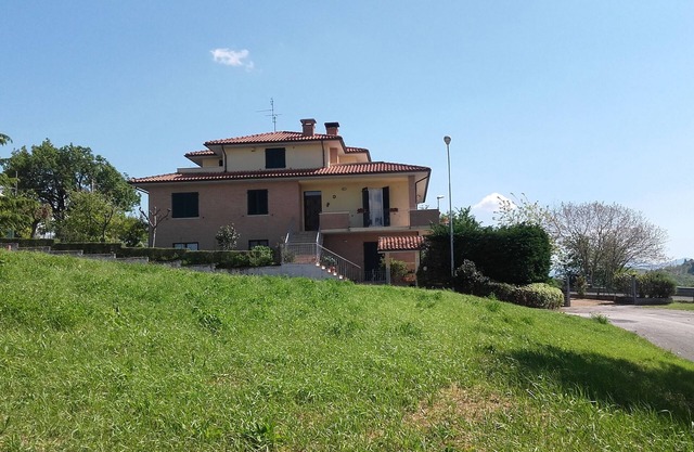 spacious apartment with a separate entrance on the ground floor and a small garden