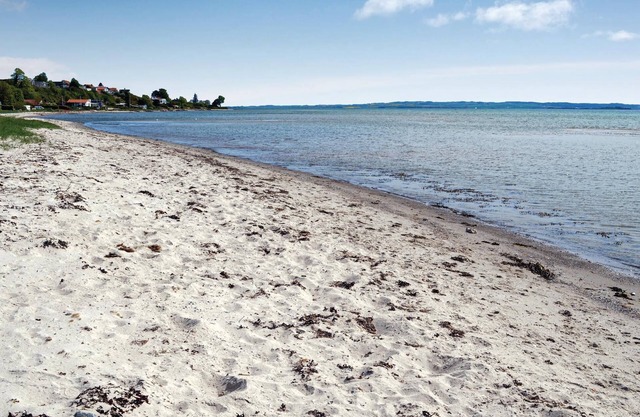 Spend your vacation near Aarhus and at the same time only a short walk from the beach.