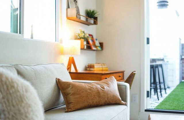 Step inside this home and discover a unique blend of mid-century retro-chic, where classic design meets a lively, modern sensibility with clean lines, warm woods, and pops of vibrant color that transport you to a cooler, more carefree era.