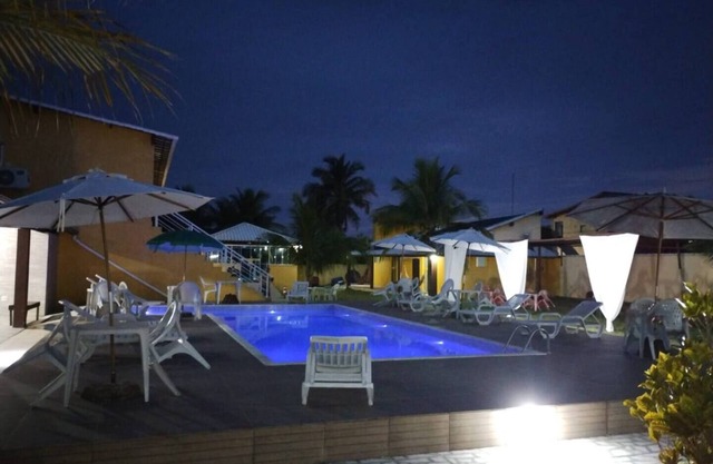 Suite with private balcony, hammock, air conditioning, minibar and queen-size bed.