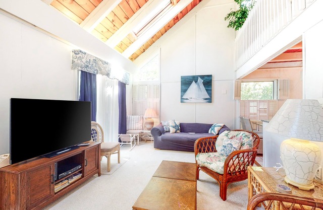 Summer home with expansive deck & wonderful location for beachgoers