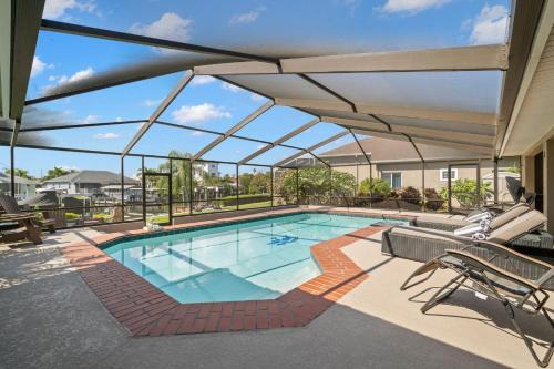Surfside Beach House - Gorgeous Canal Front Home - Heated Pool & Boat Dock
