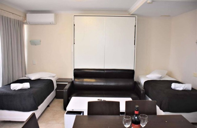 Sydney City 1 Bedroom Apartment with Balcony accommodates up to 6 people