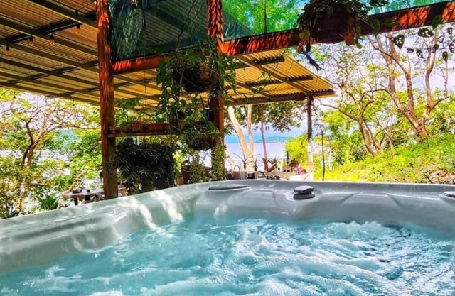 Teak house in a forest above the beach
