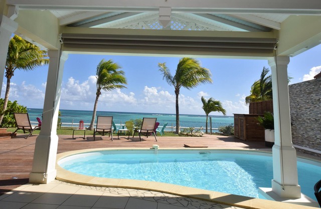 * The feet in the water, Villa JASMIN on the beach facing the lagoon