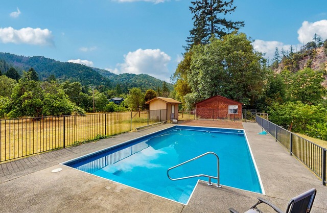 Tranquil riverfront getaway, private pool, seasonal fruit trees, & fishing