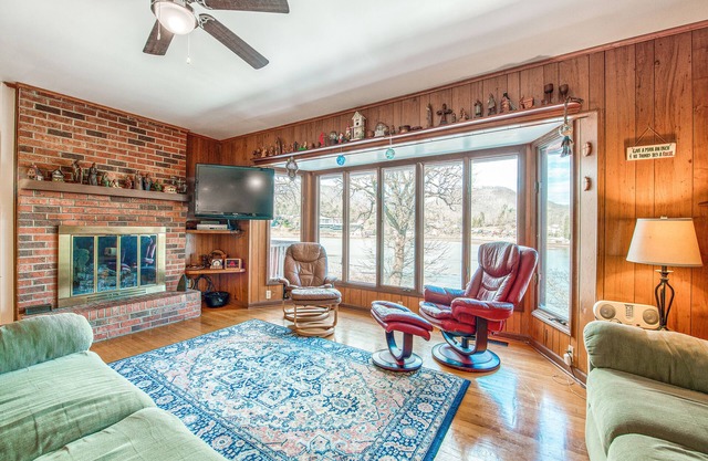 Two-story lakefront home with lake views, wood fireplace, shared outdoor pool