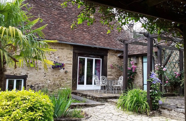 Typical stone house with swimming pool surrounded by nature