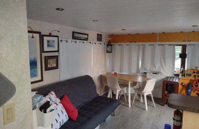 Unique houseboat rental with private dock and land on the historic Rideau River.