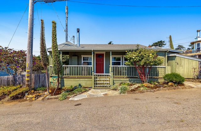 Updated, dog-friendly cottage with bay views, wraparound deck & EV charger