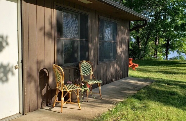 Wake up to views of Lake Pepin & enjoy beachfront access + waterfront amenities