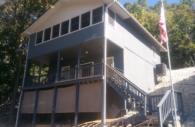 Waterfront lake home, dock, quiet swim cove next to The Cave Restaurant + many