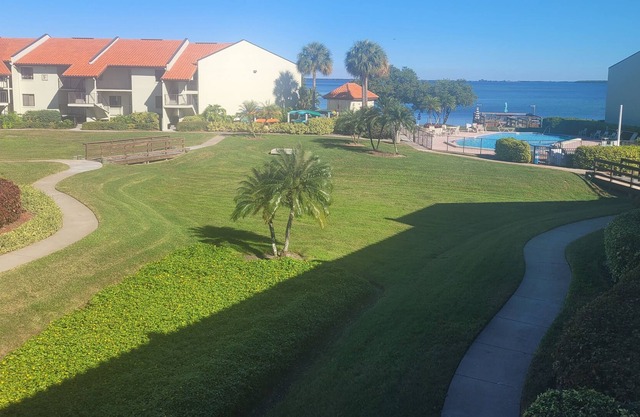 Welcome to the island lifestyle with garden and pool views on Tierra Verde!