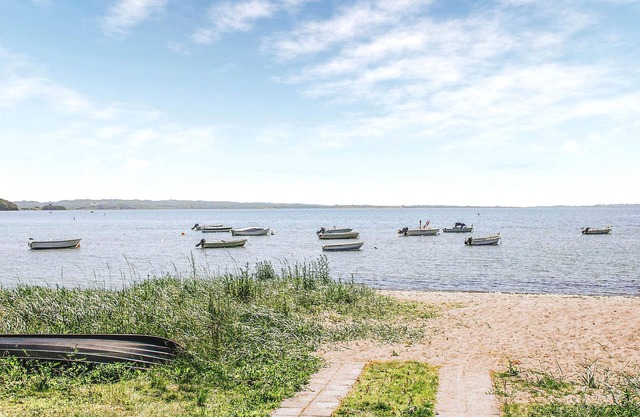 Welcome to this quiet cottage surrounded by trees near Mols Bjerge National Park.