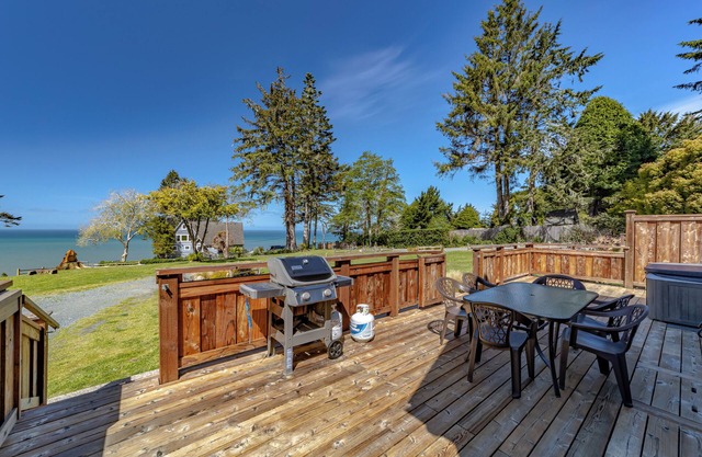 Wild ocean views, wrap-a-round deck, hot tub, expansive grounds with shared picnic tables