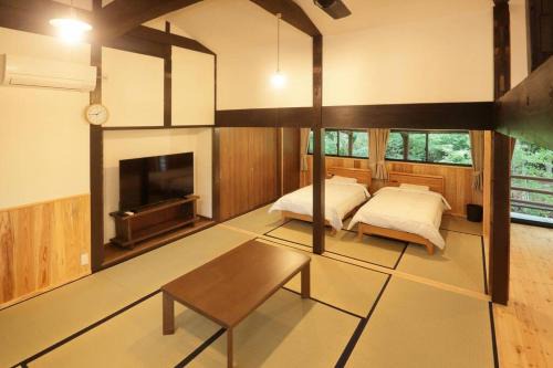 Minamiaso House | 【コテージくぎの】大谷川沿いの露天風呂があるコテージ