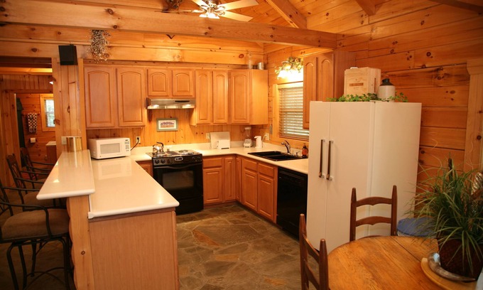 Eureka Springs Cabin | 2 story log cabin on 50 acres. Large fireplace, hot tub, covered porch.