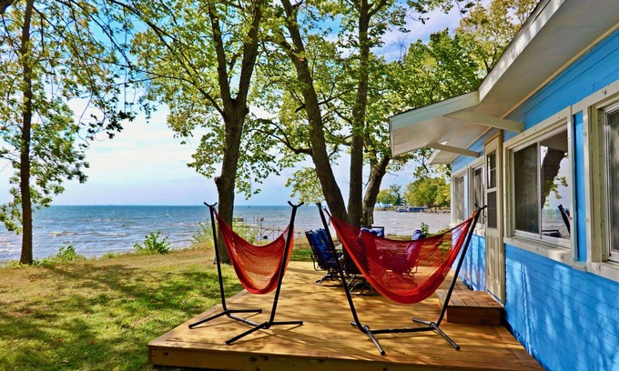 Isle Cabin | 2BR Cabin on Lake w/Beach, Boat Dock in Protected Channel, & 74ft Viewing Dock