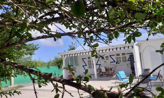 Anse des Rochers House | Agréable maison 3 pièces tout confort pour 4 personnes - Vue sur jardin