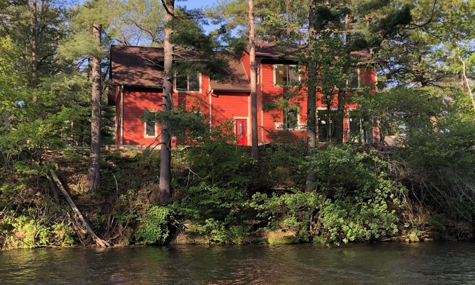Tainter Lake House | Amazing River House with covered patio! Sleeps 10-14. Kayaks,Fireplace,Games.