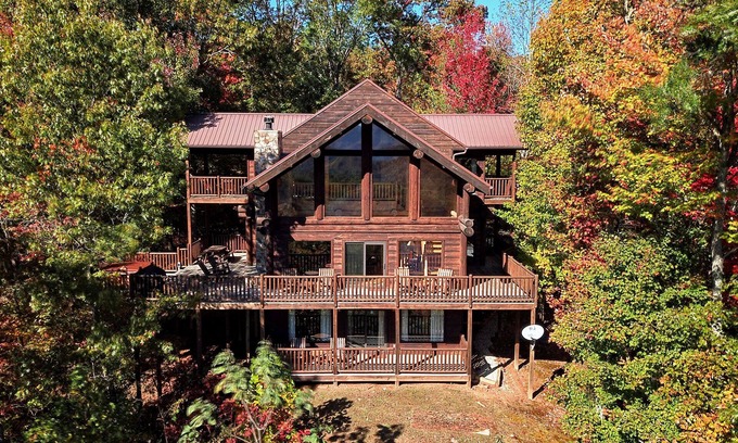 Almond Cabin | Antler Ridge - a stunning log cabin with spacious deck equipped with outdoor fireplace, hot tub, and scenic mountain views!