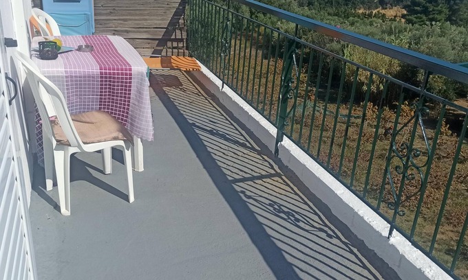 Kompi Apartment | Apartment above Peroulia beach near Koroni - taverna in front of the house