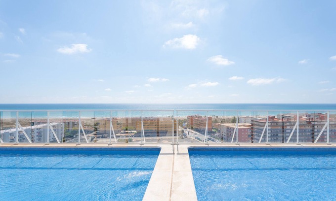Canet de Berenguer Apartment | Apartment 'Lopimar playa Canet' with Shared Pool, Wi-Fi and Air Conditioning