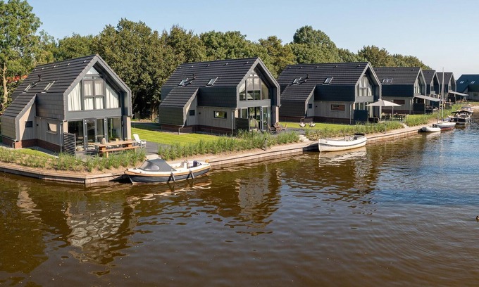 Balk House | Atmospheric sustainable villa in Balk with jetty