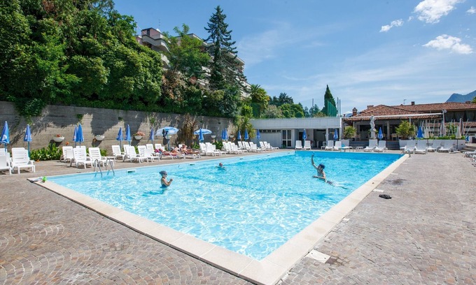 Susello Apartment | Attractive studio with terrace, garden, air conditioning, pool and dream lake view