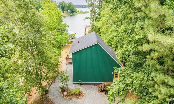 North Shore Acres House | Beautiful lake front cottage, deep water lot with covered dock and amenities.