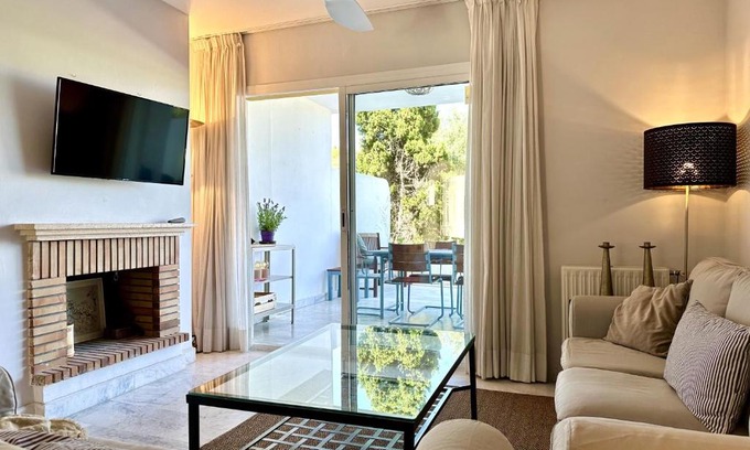Guadalmina Apartment | Blue House in Guadalmina Baja, with a large terrace overlooking the Golf
