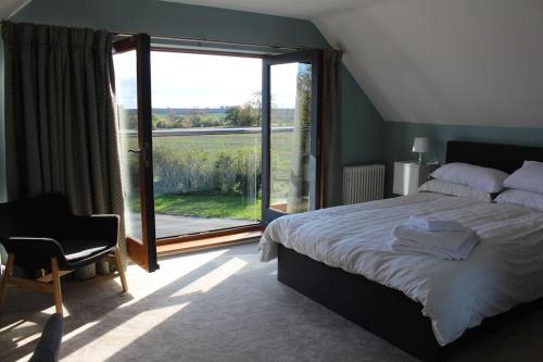 Wilby Apartment | Boutique double room with country village views