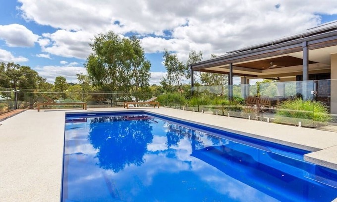 Bedfordale House | Bring the marshmallows to this luxury pool house with fireplace. Pet friendly!