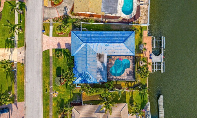 Cocoa Isles House | CanalFront | Heated Pool + Game Room w/Pool Table