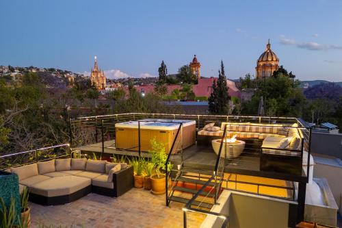Zona Centro House | Casa Cielo, 4-Story Luxury Home with Rooftop Hot Tub & AC