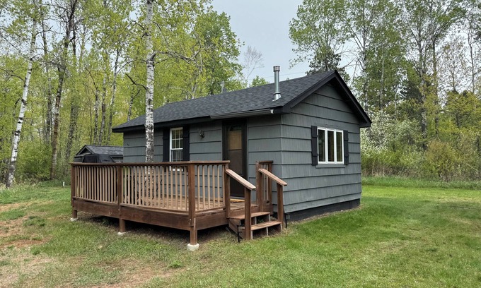 Kerrick Cabin | Charming cabin in delightful Duquette with AC near miles of ATV trails.