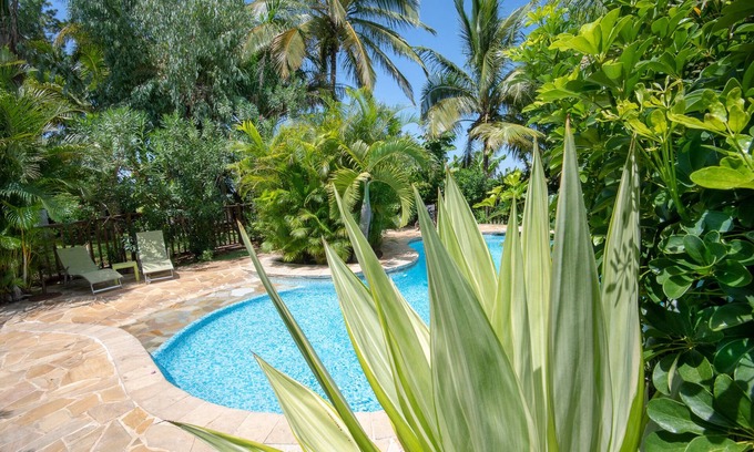 Maniron House | Charming exotic wood bungalow with pool in a tropical garden.