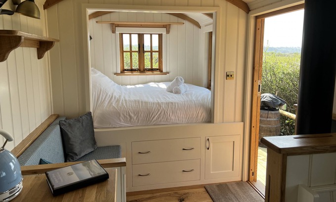 Les Vinaires Cabin | Cosy Shepherd Hut with wood burner and radiator - panoramic sea views!