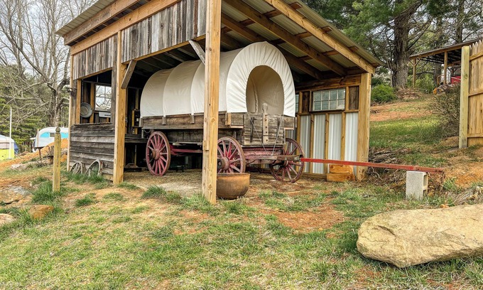 Floyd RV Rental | Covered Wagon Overlooking Pond